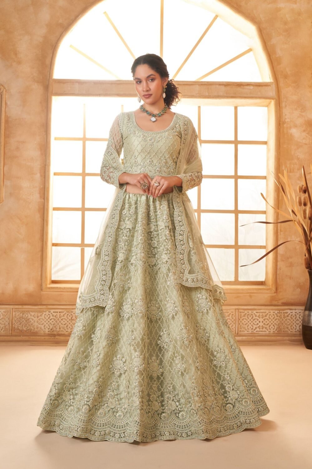 Pista Green Heavy Cording Embroidered Net Reception Lehenga Choli